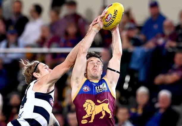 Lincoln McCarthy of the Lions and Tom Stewart of the Cats challenge for the mark during the round 14 AFL match between the Brisbane Lions and the...