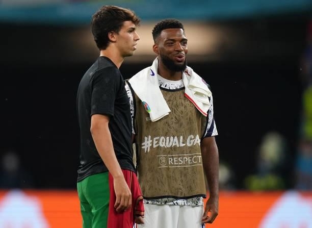 Joao Felix of Portugal speaks with Thomas Lemar of France following the UEFA Euro 2020 Championship Group F match between Portugal and France at...