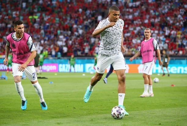 Kylian Mbappe of France warms up prior to the UEFA Euro 2020 Championship Group F match between Portugal and France at Puskas Arena on June 23, 2021...