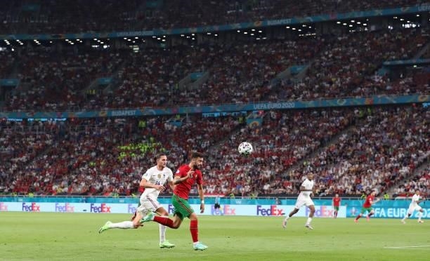 Bruno Fernandes of Portugal and Adrien Rabiot of France chase the ball during the UEFA Euro 2020 Championship Group F match between Portugal and...