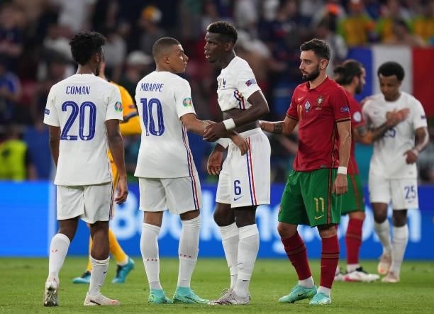 Paul Pogba and Kylian Mbappe of France interact after the UEFA Euro 2020 Championship Group F match between Portugal and France at Puskas Arena on...