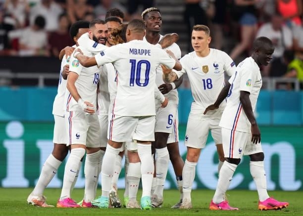Karim Benzema of France celebrates with team mates after scoring their side's second goal during the UEFA Euro 2020 Championship Group F match...