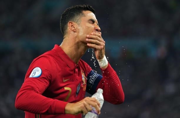 Cristiano Ronaldo of Portugal refreshes prior to during the UEFA Euro 2020 Championship Group F match between Portugal and France at Puskas Arena on...