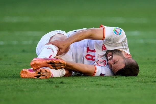 Jordi Alba of Spain lies injured on the pitch during the UEFA Euro 2020 Championship Group E match between Slovakia and Spain at Estadio La Cartuja...