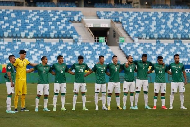 Players of Bolivia line up prior to a Group A match between Bolivia and Uruguay as part of Copa America Brazil 2021 at Arena Pantanal on June 24,...
