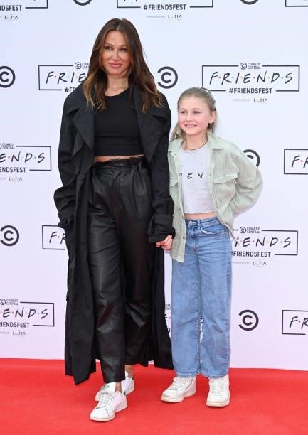 Lou Teasdale and daughter attends the Comedy Central's FriendsFest: London Photocall at Clapham Common on June 24, 2021 in London, England.