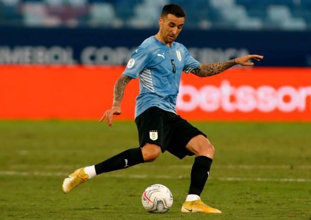 Matias Vecino of Uruguay kicks the ball during a Group A match between Bolivia and Uruguay as part of Copa America Brazil 2021 at Arena Pantanal on...
