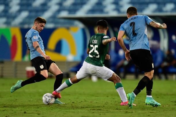 Federico Valverde of Uruguay kicks the ball again Jeyson Chura of Bolivia during a Group A match between Bolivia and Uruguay as part of Copa America...