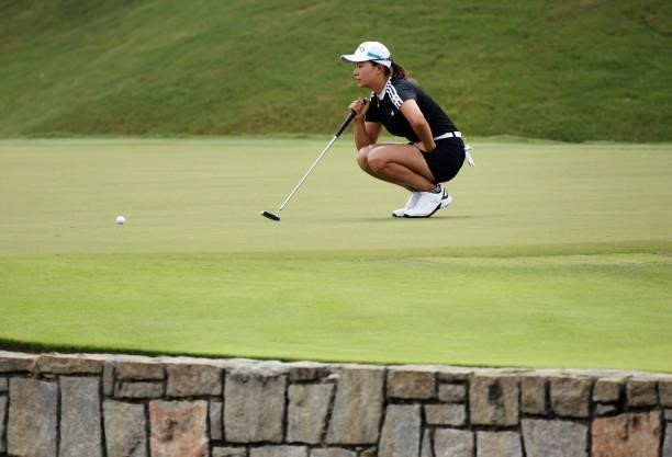 Hinako Shibuno of Japan putts on the 17th green during the first round of the KPMG Women's PGA Championship at Atlanta Athletic Club on June 24, 2021...