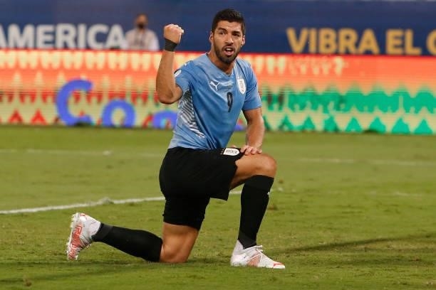 Luis Suarez of Uruguay celebrates the first goal of his team scored by an own goal from Carlos Lampe of Bolivia during a Group A match between...