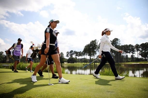 Ariya Jutanugarn of Thailand and Hinako Shibuno of Japan walk along the 17th hole during the first round of the KPMG Women's PGA Championship at...