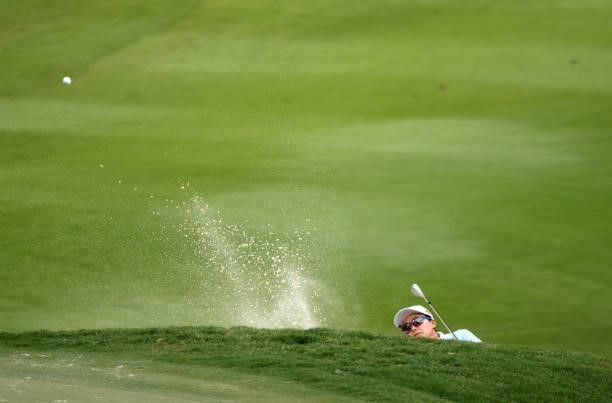 Ayako Uehara of Japan plays a shot from a bunker on the 14th hole during the first round of the KPMG Women's PGA Championship at Atlanta Athletic...