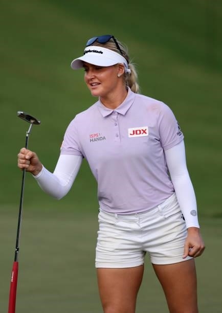 Charley Hull of England reacts to her par putt on the ninth hole during the first round of the KPMG Women's PGA Championship at Atlanta Athletic Club...
