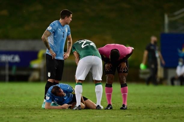 Diego Godin of Uruguay reacts after suffering an injury during a Group A match between Bolivia and Uruguay as part of Copa America Brazil 2021 at...