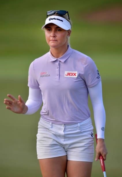 Charley Hull of England reacts to her par putt on the ninth hole during the first round of the KPMG Women's PGA Championship at Atlanta Athletic Club...