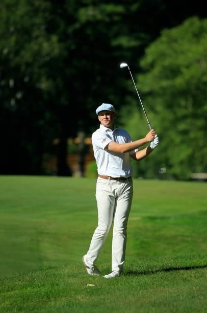 Harry Hall of England hits his second shot on the eighth hole during the first round of the Live And Work In Maine Open held at Falmouth Country Club...