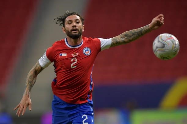 Eugenio Mena of Chile runs after the ball during a Group A match between Chile and Paraguay as part of Copa America Brazil 2021 at Mane Garrincha...