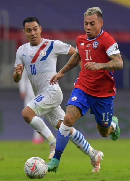 Eduardo Vargas of Chile controls the ball against Ángel Cardozo of Paraguay during a Group A match between Chile and Paraguay as part of Copa America...