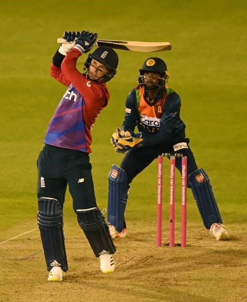 Sam Curran of England hits a six watched by Niroshan Dickwella of Sri Lanka during the second T20 International between England and Sri Lanka at...