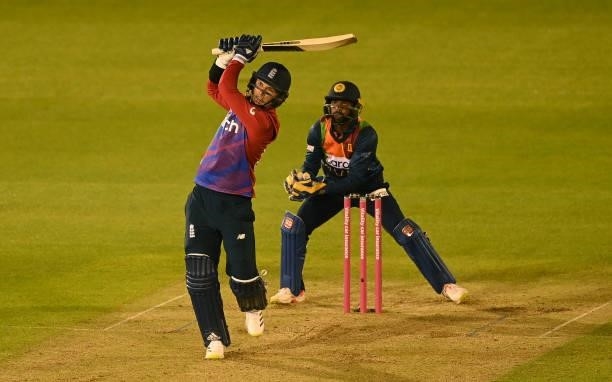 Sam Curran of England hits a six watched by Niroshan Dickwella of Sri Lanka during the second T20 International between England and Sri Lanka at...