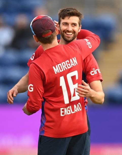 Mark Wood hugs Eoin Morgan of England after the dismissal of Niroshan Dickwella of Sri Lanka during the second T20 International between England and...