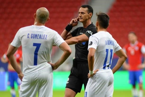 Referee Wilmar Roldan waits for a play review during a Group A match between Chile and Paraguay as part of Copa America Brazil 2021 at Mane Garrincha...