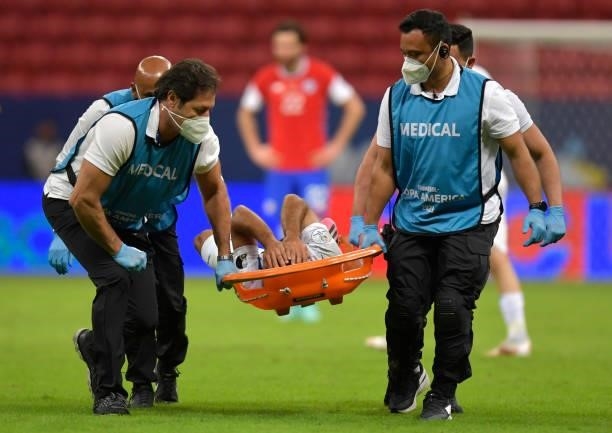 Antonio Bareiro of Paraguay leaves the pitch in a stretcher during a Group A match between Chile and Paraguay as part of Copa America Brazil 2021 at...