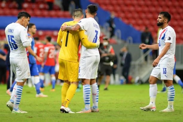 Antony Silva of Paraguay celebrates with teammate Omar Alderete after winning a Group A match between Chile and Paraguay as part of Copa America...