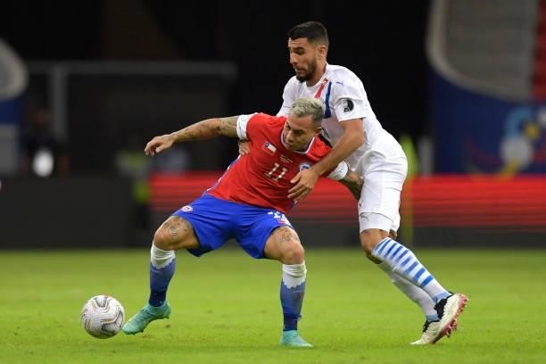 Eduardo Vargas of Chile fights for the ball with Junior Alonso of Paraguay during a Group A match between Chile and Paraguay as part of Copa America...