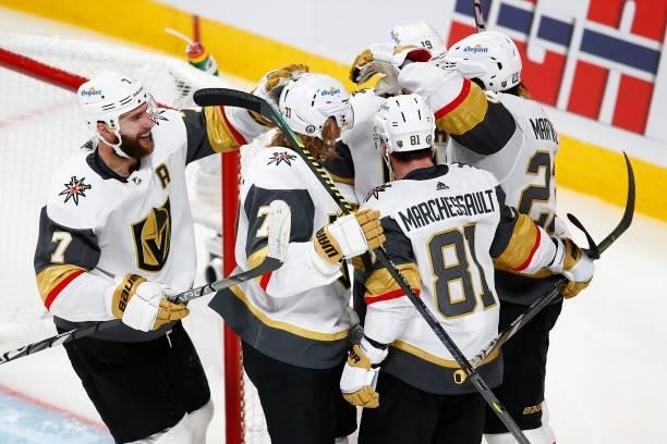Alec Martinez of the Vegas Golden Knights is congratulated by his teammates after scoring a goal against the Montreal Canadiens during the third...