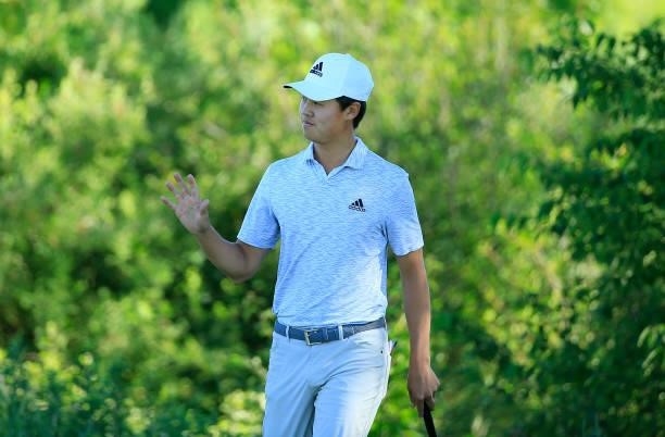 Brandon Wu celebrates his birdie on the 12th green during the first round of the Live And Work In Maine Open held at Falmouth Country Club on June...