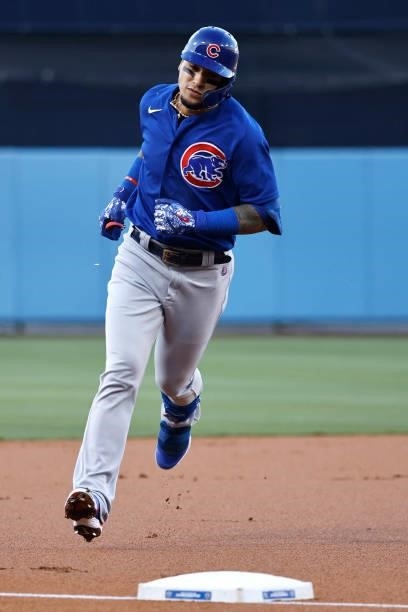 Javier Baez of the Chicago Cubs rounds the bases after hitting a solo home run against the Los Angeles Dodgers during the first inning at Dodger...
