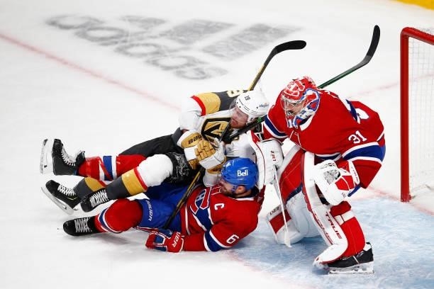 Reilly Smith of the Vegas Golden Knights collides with Shea Weber and Carey Price of the Montreal Canadiens during the third period in Game Six of...