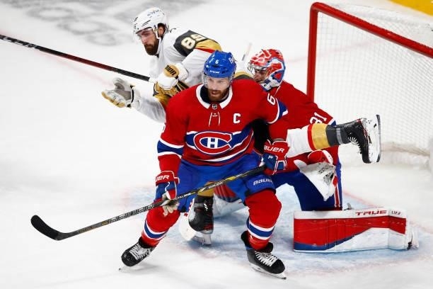 Alex Tuch of the Vegas Golden Knights and Shea Weber of the Montreal Canadiens battle for position in front of Carey Price during the third period in...