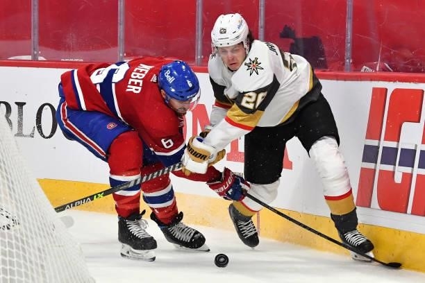 Shea Weber of the Montreal Canadiens and Mattias Janmark of the Vegas Golden Knights battle for the puck during the third period in Game Six of the...