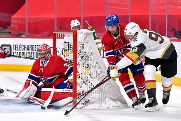 Tomas Nosek of the Vegas Golden Knights attempts a wrap-around on Carey Price of the Montreal Canadiens as Nick Suzuki defends during the third...