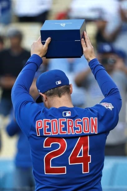 Joc Pederson of the Chicago Cubs walks back to the dugout after receiving his World Series Ring from Clayton Kershaw of the Los Angeles Dodgers prior...