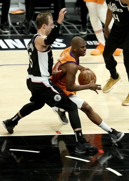 Chris Paul of the Phoenix Suns is pressured by Luke Kennard of the LA Clippers during the second half of game three of the Western Conference Finals...