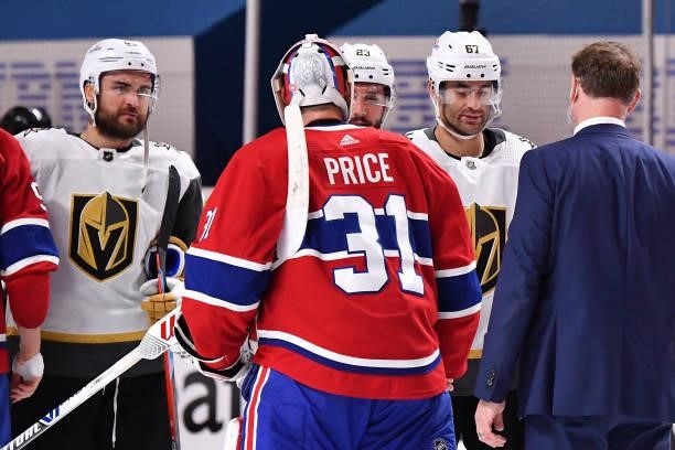 Carey Price of the Montreal Canadiens and Alec Martinez of the Vegas Golden Knights shake hands following the Canadiens 3-2 overtime win in Game Six...