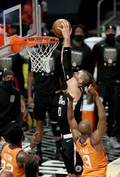 Ivica Zubac of the LA Clippers dunks against the Phoenix Suns during the second half of game three of the Western Conference Finals at Staples Center...