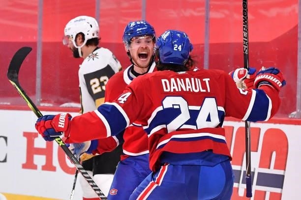 Artturi Lehkonen of the Montreal Canadiens is congratulated by Phillip Danault after scoring the game-winning goal during the first overtime period...