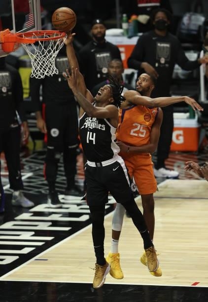 Terance Mann of the LA Clippers goes up for a shot against Mikal Bridges of the Phoenix Suns during the second half of game three of the Western...