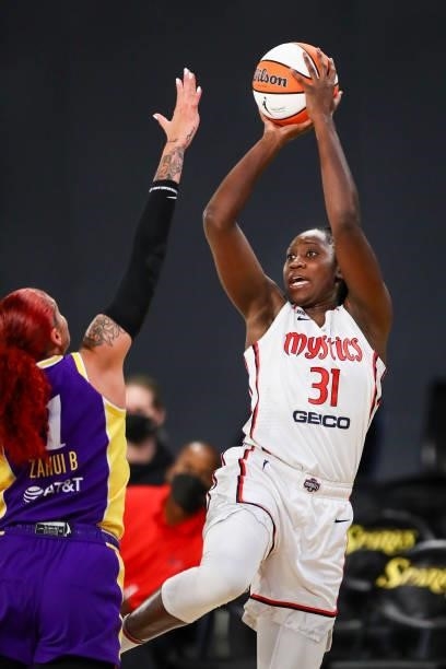Center Tina Charles of the Washington Mystics shoots defended by center Amanda Zahui B of the Los Angeles Sparks in the first half at Los Angeles...