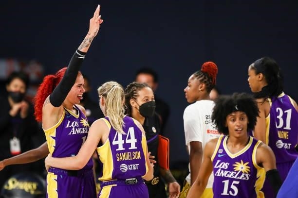 Center Amanda Zahui B celebrates a three point basket by forward Karlie Samuelson of the Los Angeles Sparks at the end of the first half against the...