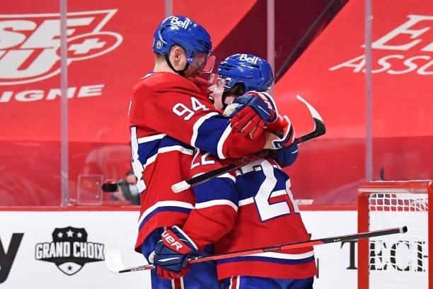 Corey Perry and Cole Caufield of the Montreal Canadiens celebrate the game-winning overtime goal scored by Artturi Lehkonen against the Vegas Golden...