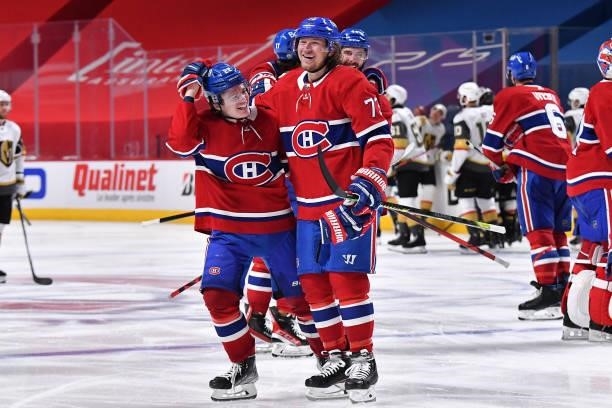 Tyler Toffoli and Cole Caufield of the Montreal Canadiens celebrate the game-winning overtime goal scored by Artturi Lehkonen against the Vegas...