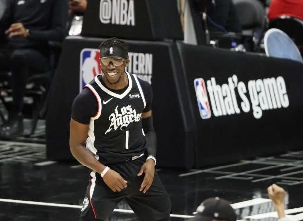 Reggie Jackson of the LA Clippers celebrates a three point basket against the Phoenix Suns during the second half of game three of the Western...