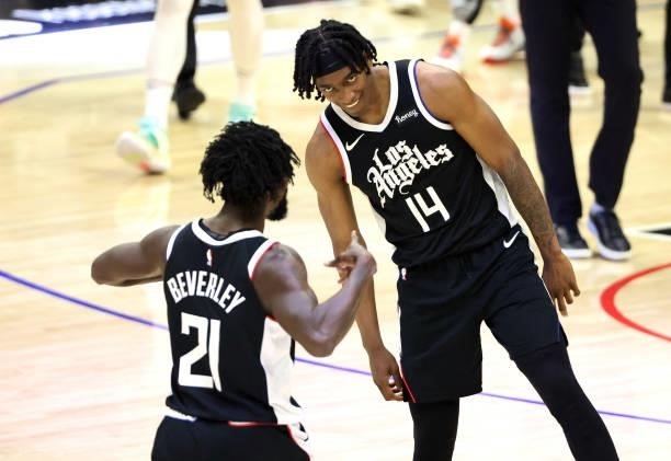 Patrick Beverley of the LA Clippers celebrates a three point basket with Terance Mann during the second half of game three of the Western Conference...