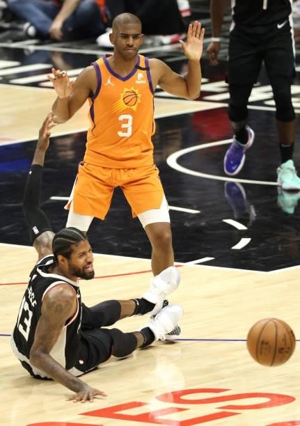 Paul George of the LA Clippers looses the ball against Chris Paul of the Phoenix Suns during the second half of game three of the Western Conference...