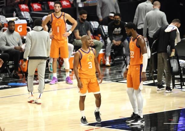 Chris Paul and Deandre Ayton of the Phoenix Suns discuss play during the second half of game three of the Western Conference Finals against the LA...